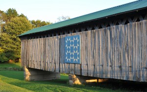 Graham Road, the center piece of an Ashtabula County Metro Park, sports an 8X8 barn quilt that honors the Benson family, which donated the land the covered bridge rests upon.