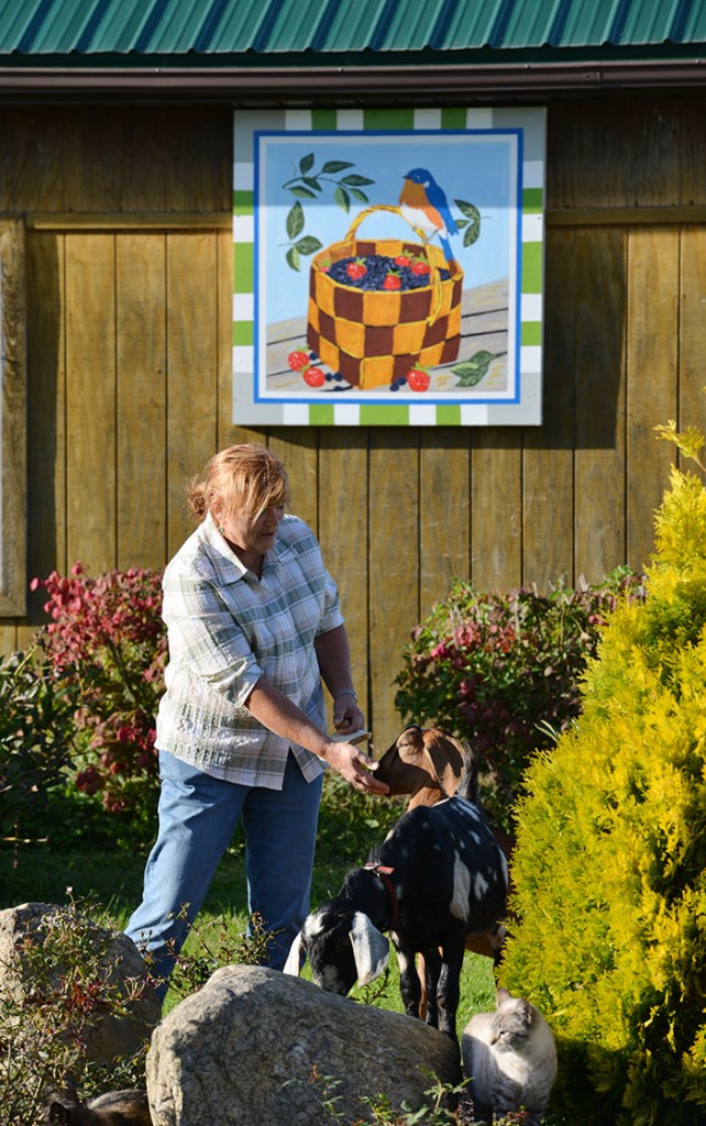 Karla Gadley with one of the kids from her blueberry farm.