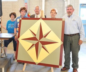 From left, Kathy McCarty, Chris Angerman and commissioners Dan Claypool, Peggy Carlo and Joe Moroski with the Mariner's Compass barn quilt.