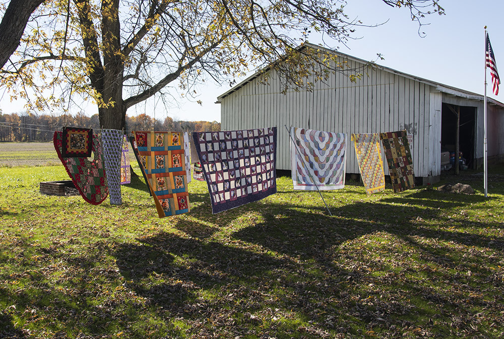 A few of Evelyn's quilts hang on the clothesline.