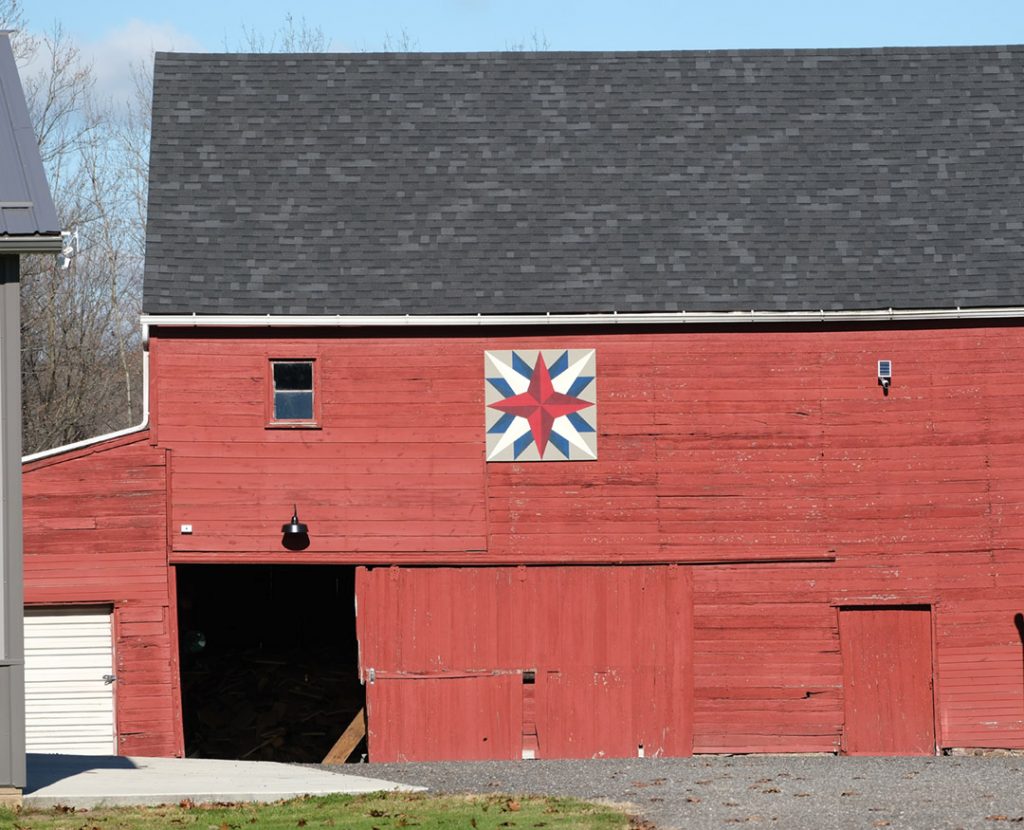 barn quilt on red barn